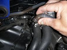 Disconnecting crankcase breather hose - click for larger image